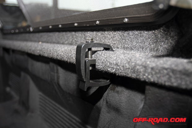 Once seated atop the truck bed, four fasteners keep the bed secure in place.