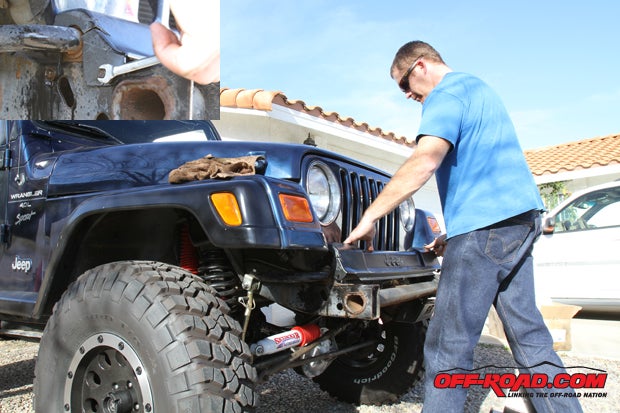 Remove the Jeep cover, which is held in by two bolts (shown on inset) on each side that hold on the cover.