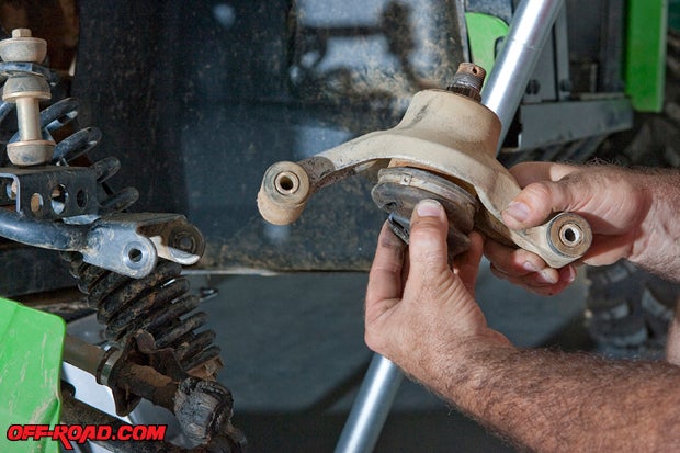 A broken axle cup may need a little convincing with a rubber hammer to get it out of the knuckle.