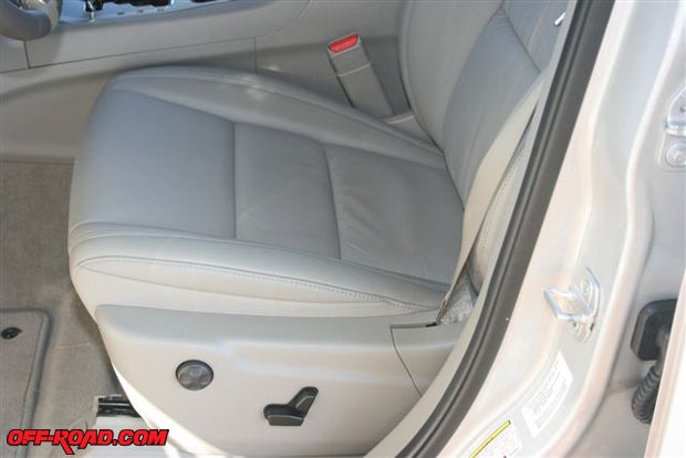 The leather-trimmed bucketseats up front are equipped with eight-way power controls including a four-way lumbar adjustment.
