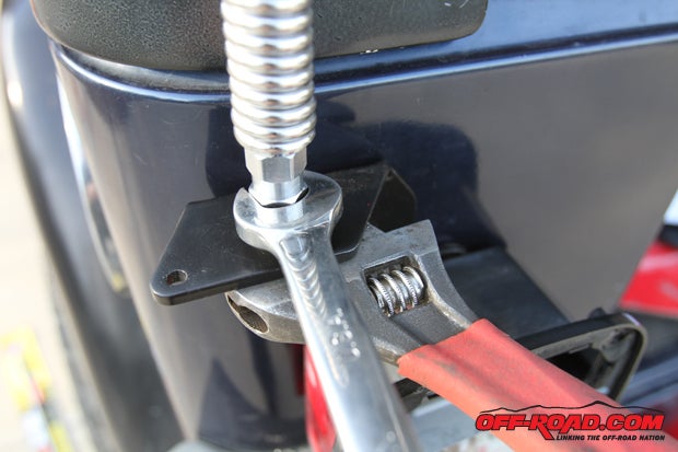 With the mount installed, the stainless-steel spring and stud mount from Firestik are tightened down.