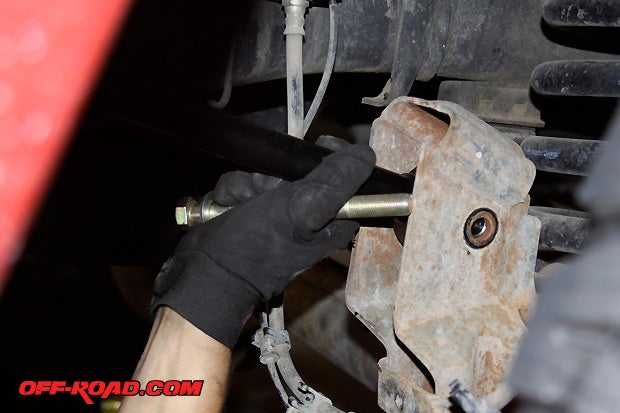 On some Cummins diesel trucks, the pivot bolts closest to the exhaust side may need to be cut off in order to remove the upper control arm. There isnt enough clearance to remove the bolt without taking the exhaust pipe off. Replacement pivot bolts are provided by Thuren for such cases.
