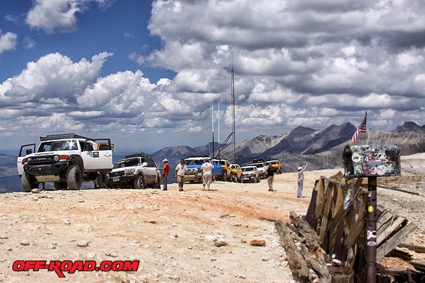 FJ Summit trail boss Don Wikid brings a group over Imogene Pass (elev. 13,114 ft.) in his highly modified FJ Cruiser. An old visitor mailbox and radio antennas make it worth the stop. Theres also a great birds eye view of Telluride, CO, from this vantage point (Photo Elizabeth Hernandez).