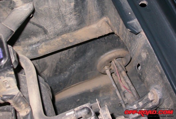 This extra-convenient wiring port (from the engine bay to the cabin) is at the extreme drivers-rear corner of the engine bay on third-gen 4Runners.
