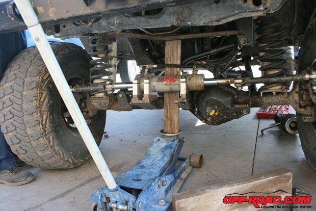 Before removing the mount, support the engine with a floor jack. You may need to raise and lower the engine in order for all of the bolts to be slipped into place.