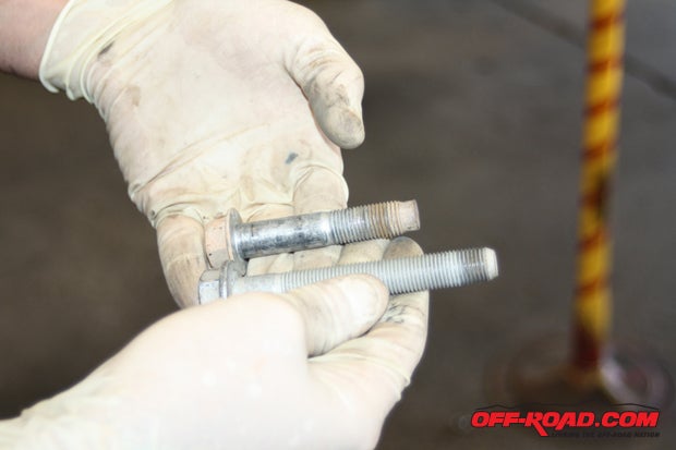 Suspension bolts are strong enough, but not always long enough. Swapping one thats got an extra inch makes short work of anchoring one strap tab, on independent or solid-axle settings.