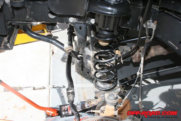Install the coil springs, one side at a time.