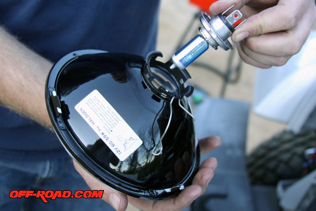 Carefully insert the IPF H4 bulb into the headlamp housing and secure with retainer clip.