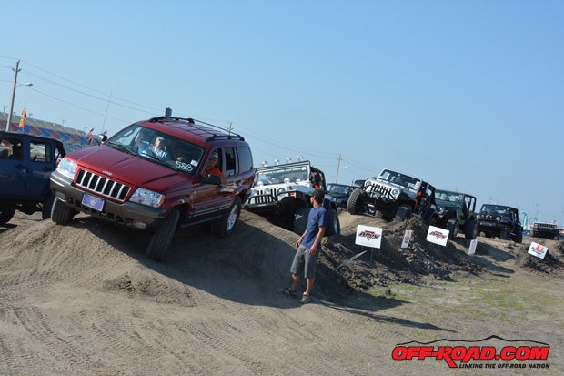 This lifted WJ leads other Jeeps through the obstacle course.