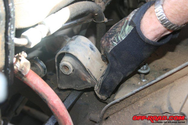 Once the engine is supported and all the nuts and bolts are removed, you can slip the motor mount out.