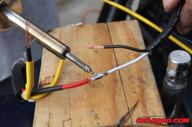 We solder the electrical connections to create a secure connection that wont wiggle loose on the trail. 