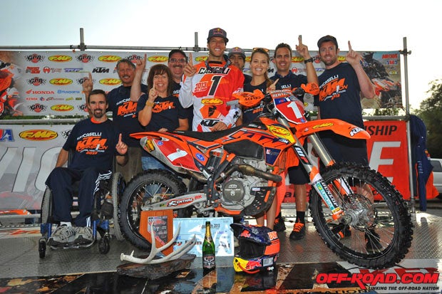 KTMs crew and associates surround Kurt Caselli after his victory cemented his third consecutive series championship.