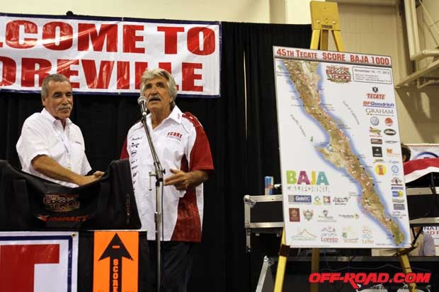 Sal Fish (right) and Frank DeAngelo of BFGoodrich Tires unveil the 2012 Tecate SCORE Baja 1000 track map before the drawing for starting positions in the race. 