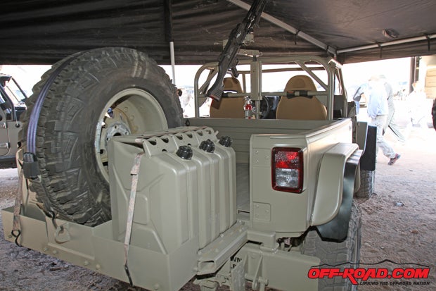 This setup provides the Jeep with a 1000-mile range with its spare tire and six fuel jugs on back. 