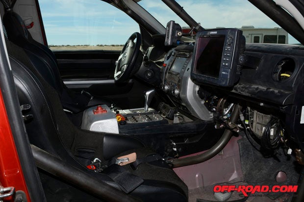 The interior of the TRD Pro that will take on the Baja 1000 is all racetrick - roll cage for added support and safety, navigation for the co-driver, and switches to control everything from fans to radios. 
