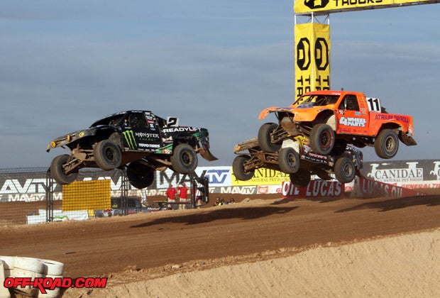 Jeremy McGrath (2), Adrian Cenni (11) and Rob Naughton (background) battle during the Pro 2 vs. Pro 4 Cup Race.