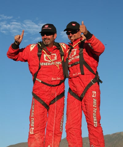Rick D. Johnson (right) and co-driver Brian Sallee celebrate their overall victory. 