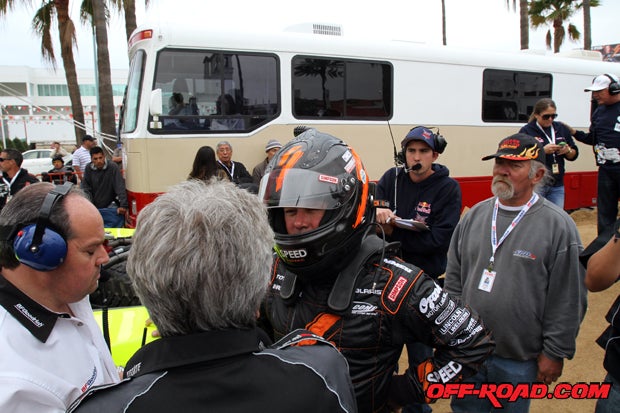 Robby Gordon expresses his concern over potential issues with the Trophy Truck restart due to a semi-truck accident that blocked the course only a few miles into the race. 