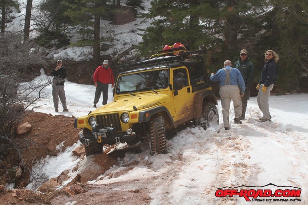 Ed and Janice Helmick has an eye-opening moment when they were getting pulled by our guide Bill Burke through a deep snow bank and nearly took a spill off the edge. The Superwinch came to the rescue and got the yellow TJ back on the road and through the bank. 