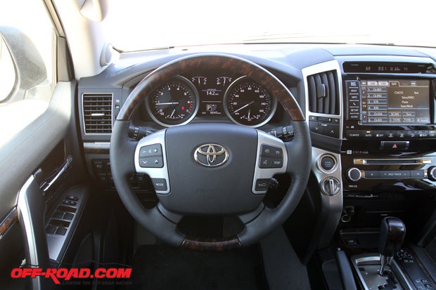 The wood-trim carries over to the steering wheel as well, which features controls for the stereo, BlueTooth phone functions and more.  