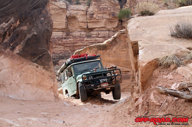 Hugh Phillips of Safari Limited of Colorado navigates his 1983 Land Cruiser Trooper Carrier through this tight pass. 
