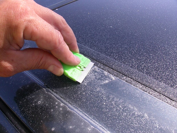 Prepare to scrape. Used carefully, a razor blade will glide over the color, and separate the flaking clear from it. For clears that aren't flaking, prepare to sand.