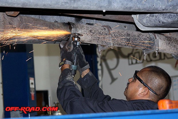 Using a pneumatic cutting wheel might be necessary to allow extra wiggle room to slip the factory pipe and muffler off.