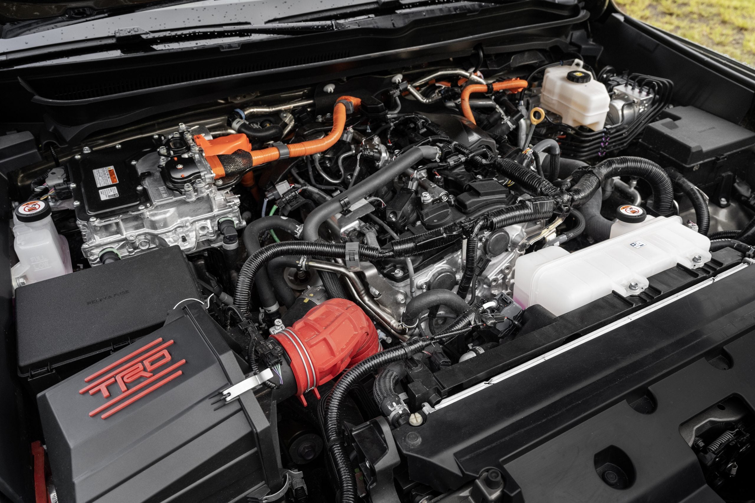 The i-Force Max hybrid engine seen under the hood of a Toyota Tacoma