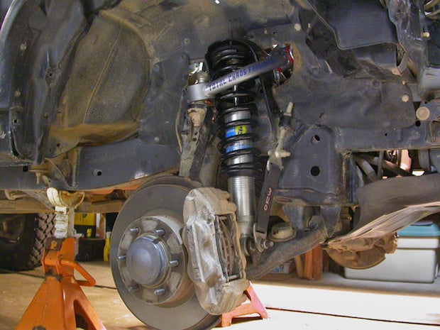 The oversize shock body requires attention be paid to nearby parts. The lower clevis for the limiting strap needed to be pushed out about 5mm on the lower shock bolt.