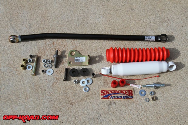 The Skyjacker Adjustable Track Bar for our Jeep Wrangler TJ includes a new adjustable track bar, rod end, steering damper and all necessary hardware.