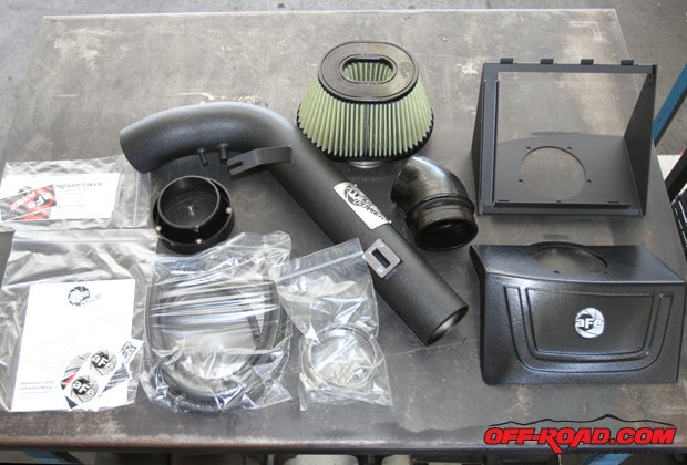 The aFe Stage 2 cold air intake kit for the 6.2-liter Ford Raptor engine  and other 6.2-liter Ford trucks  comes with everything needed for a quick, complete bolt-on installation. We also have the optional cover (bottom right) included as part of the installation. 