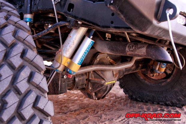 In the rear, thre-link suspension using Synergy springs and 2.5 adjustable King shocks and bump stops help keep the Dynatrac ProRock 80 planted to the ground. Some additional upgrades include AFE Power cat back exhaust and TNT Customs steel bumper.