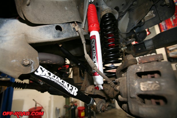 The front suspension starts to come together with the installations of the front shocks after the springs and controls arms are in place. 