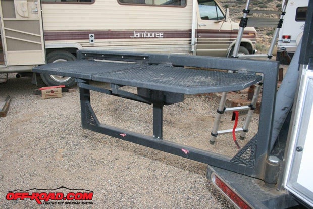The 44x12-inch galley preparation table, which acts as protection for the galley hatch, swings out and locks into place with spring-loaded pins. The trays of expanded metal swing up and are supported by hinged arms.