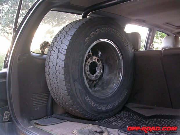This tires a 265/75/16, with room. We slid a set of 275/70/17 MT/Rs under the rollbar with room to spare too, and our estimations suggest theres space for a 35.
