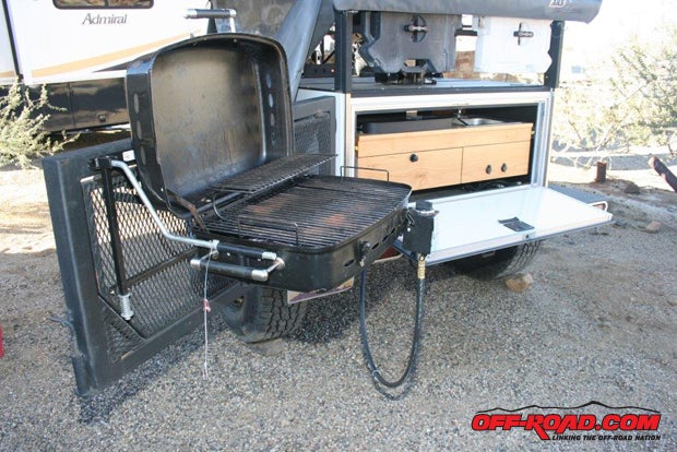 If you opt for the optional Side Kick Grill ($149), it slides into brackets on swing-out tailgate and connects to the included LPG hose that’s already routed to the galley.
