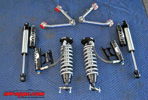 The main components to improve the suspension performance of Tickles Silverado are shown here: Fox 2.5 Performance Series DSC coilover shocks, rear Fox 2.5 Performance Series piggyback shocks with DSC, and Total Chaos upper control arms. 