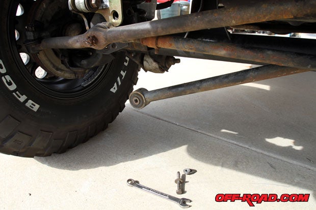 With the steering stabilizer off, the stock track bar was removed from the passenger side of the axle.