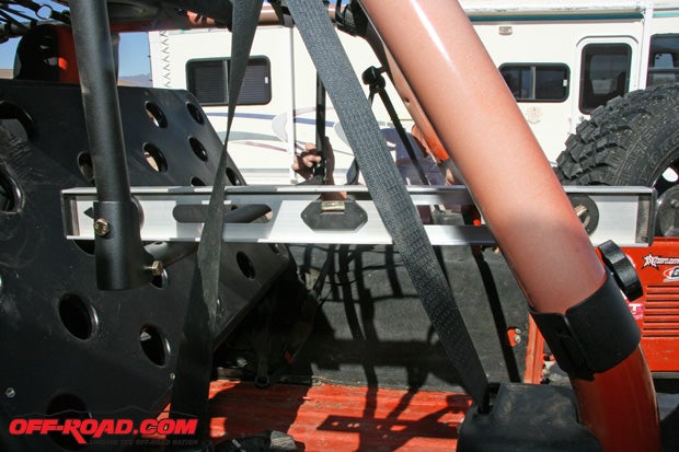 While positioning the roll bar clamps, if your Jeep sits level, adjust the tray to where it is also level.