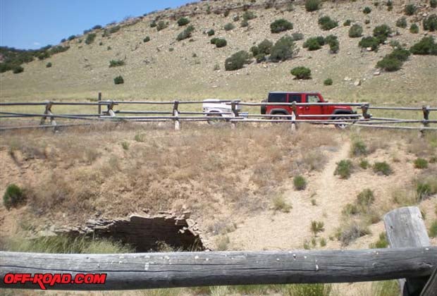 The Sinkhole is a natural vertical shaft in the middle of a meadow. It is surrounded by a split-log fence to keep the wild tourists, horses and burros that populate this area from falling in.