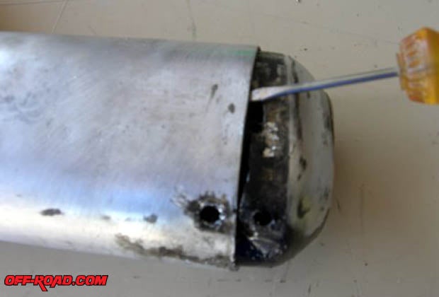 The tip of the muffler can now be gently pried apart with the aid of small flat screwdriver.