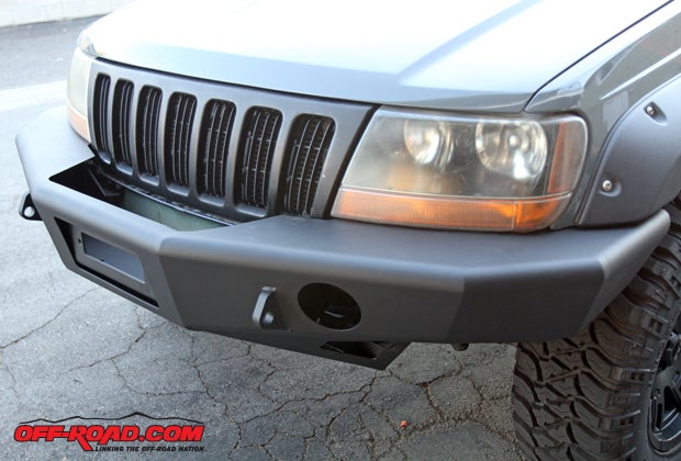 The Trail Ready front bumper for our WJ provides improved approach angles, and its incorporated skid plate offers some added protection for the front end. 
