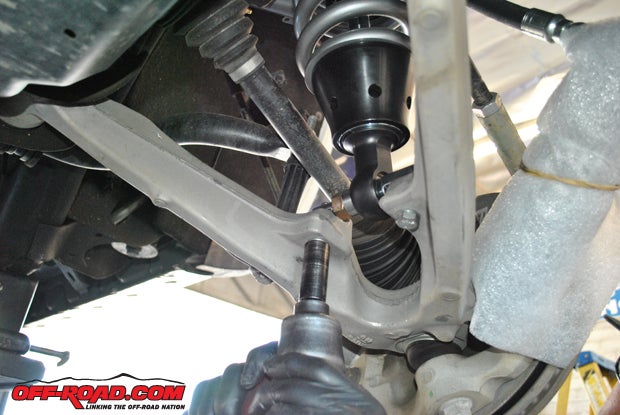 The lower control arm for the Silverados front suspension remains unchanged, and once the Fox coilover is bolted in place the lower arms can be bolted up as well. 