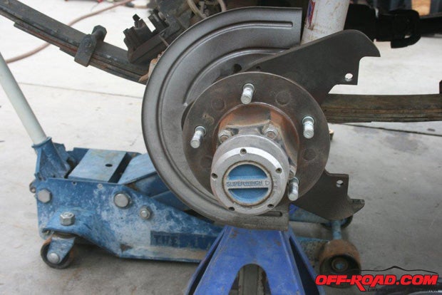 After removing the caliper and disc, remove the free-wheeling hub.