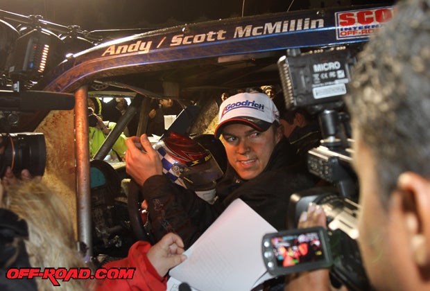 An emotional Andy McMillin faces the media storm after earning his third Baja 1000 victory. 