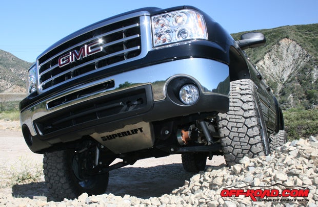 To protect the front suspension off-road, Superlift made a custom stainless-steel skidplate.