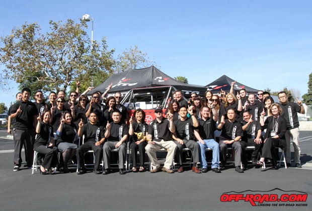 Loren Healy celebrates his victory with the Nitto Tire team at its U.S. headquarters in Southern California. 