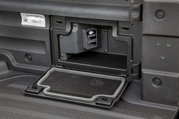 The truck bed features a 400-watt power outlet, but unfortunately Honda only features a two-prong connection.