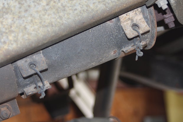 Some old-truck charm for you: 30 years ago, when the muffler brackets failed somewhere between Point A and Point W, bailing wire was used to reconnect the collars. 30 years later...