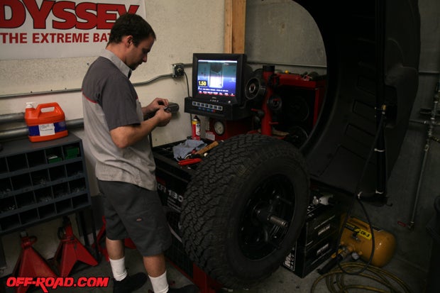 Brian Carta or Off Road Warehouse balances the new wheel-and-tire combo. 